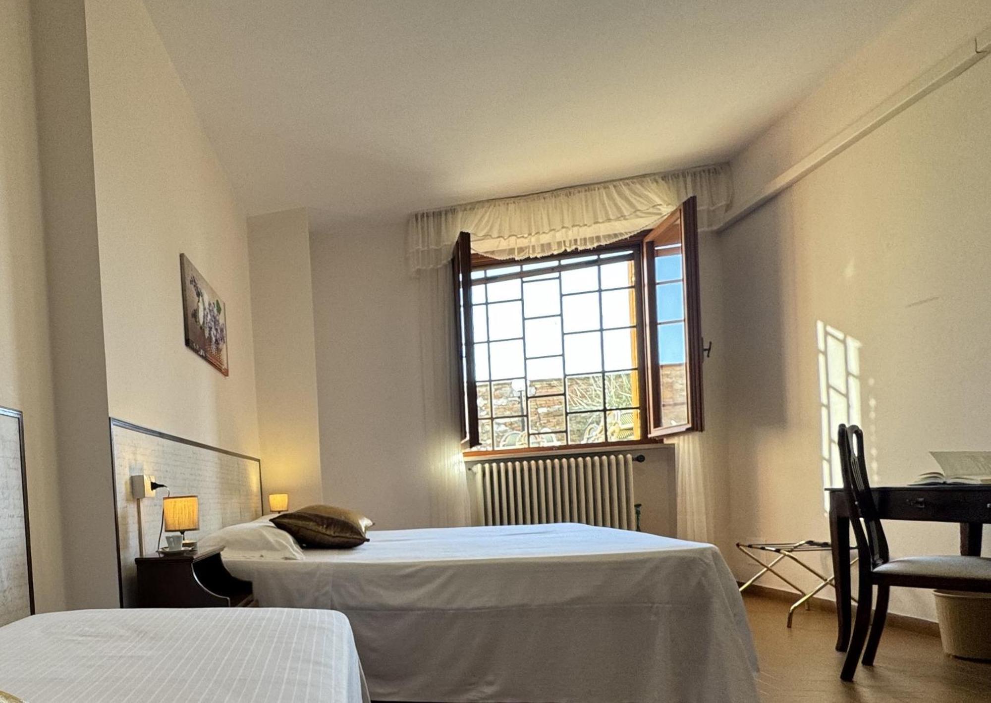 Hotel Monastero Ss. Annunziata Todi Zimmer foto A room at the hotel